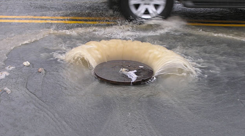 Sewage flowing from a manhole.