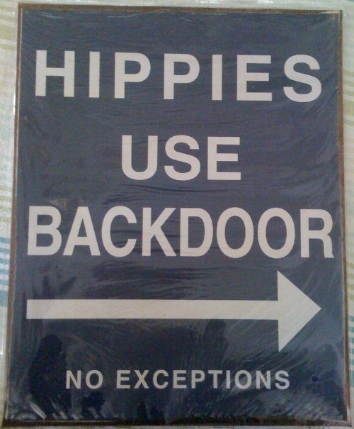 Hippies use back door sign.