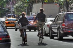 city-bicycling-holding-hands-featured
