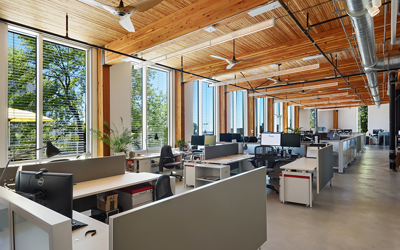 Office area with wood ceiling and view of trees outside