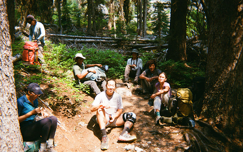 Hikers sitting with their backpacks