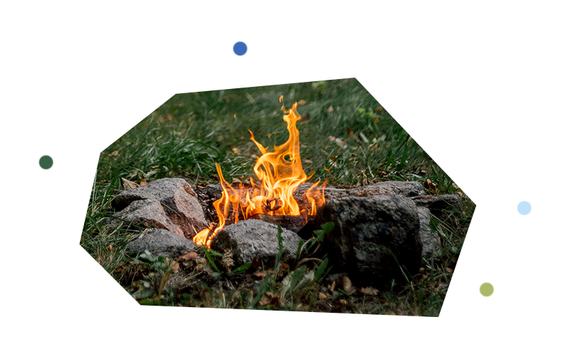 Rocks surround small campfire