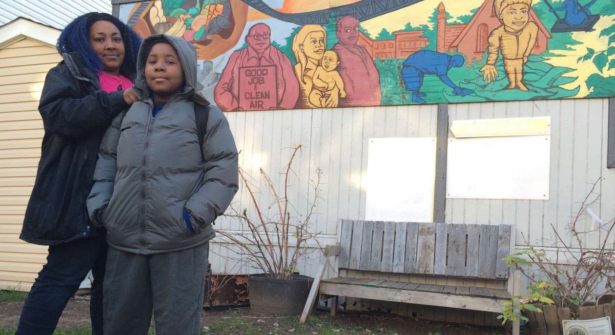 Tamika Bowers and her 10-year-old son, Tíyonn, outside an Ironbound Community Corp. building beside Tíyonn's school.