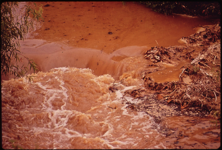 Wastewater from a paper mill in Louisiana pollutes water downstream in 1972.