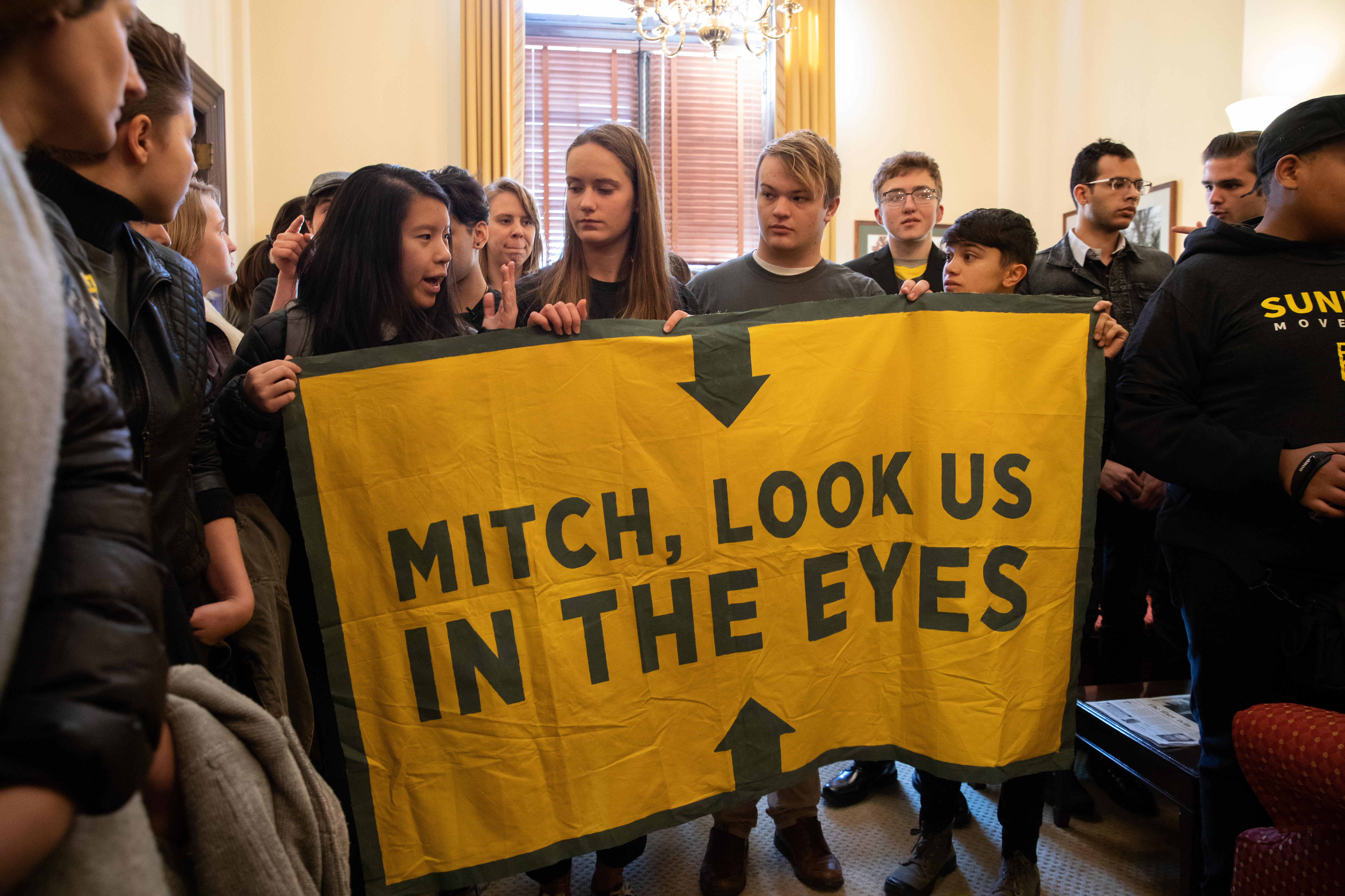 Young activists inside Senator Mitch McConnell's office.
