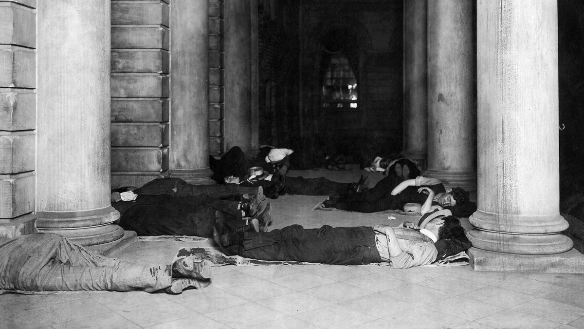 People sleep at the cool marble-floor of the City Hall during a heatwave.