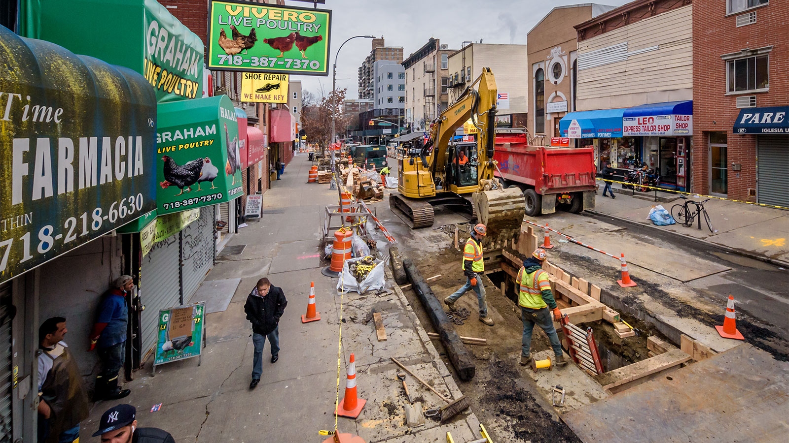 Heavy machinery and construction workers on Moore Street in Brooklyn