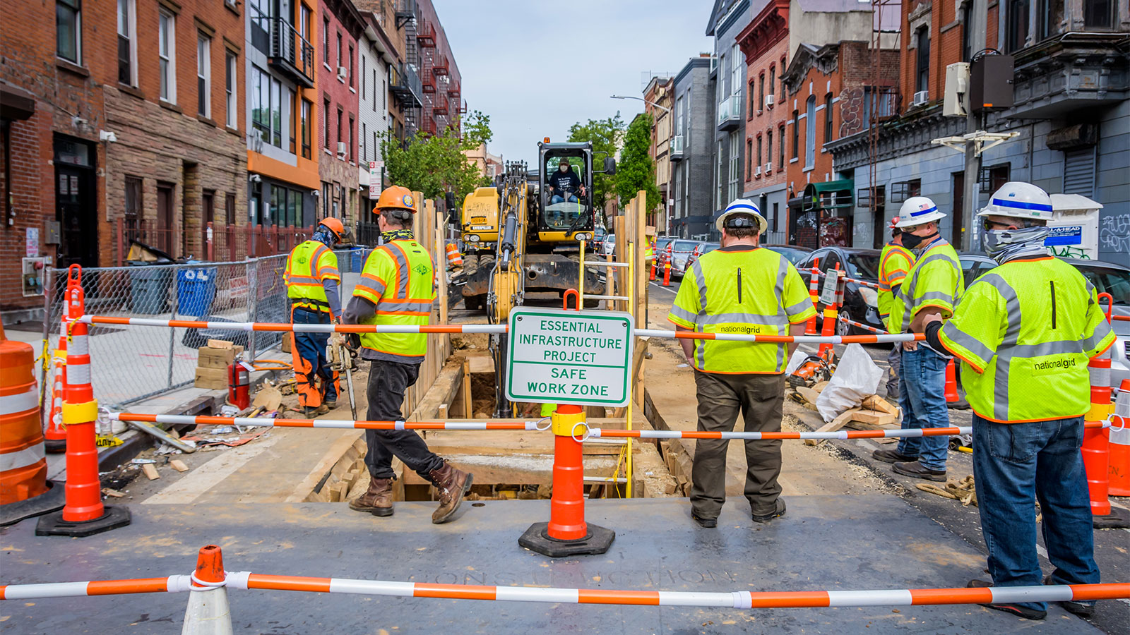 Heavy machinery and construction workers on Montrose Avenue in Brooklyn