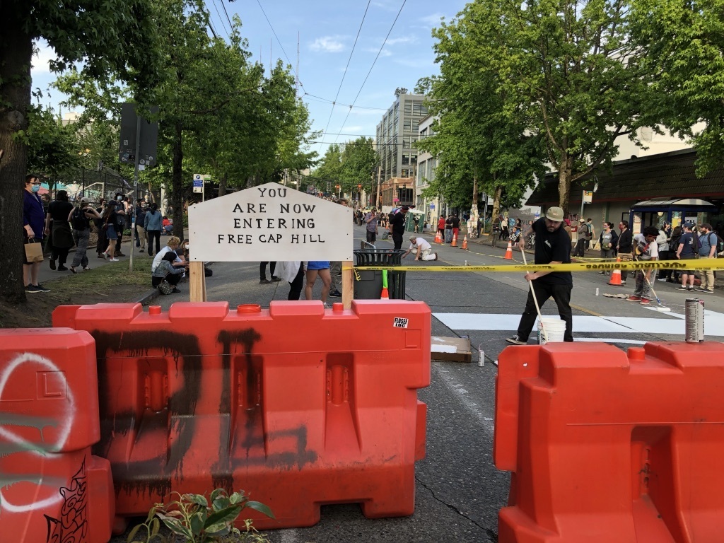 photo of barricades and sign at Seattle CHOP
