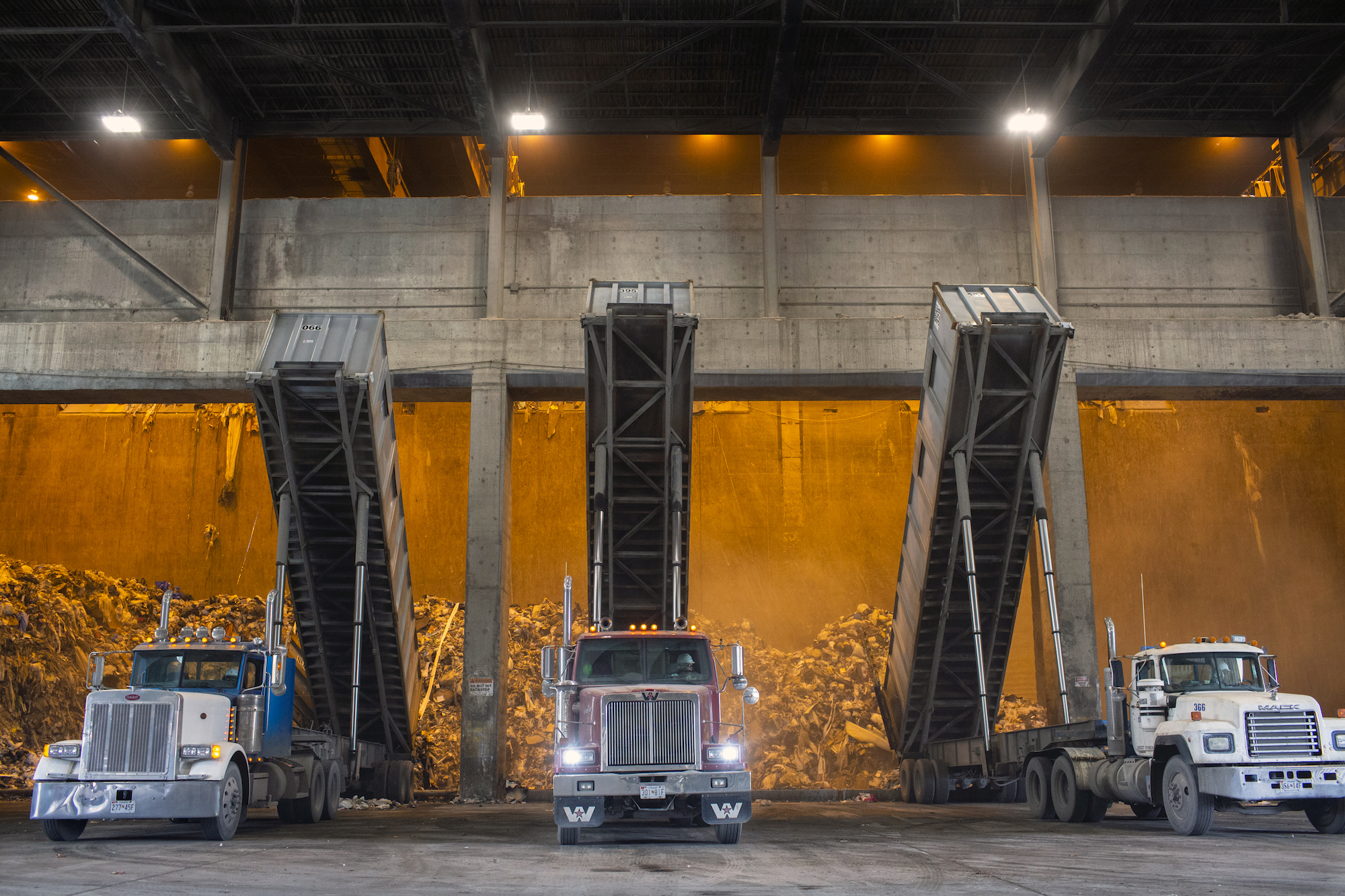 A photo of trucks dumping garbage at the Covanta incinerator in Montgomery County, Maryland