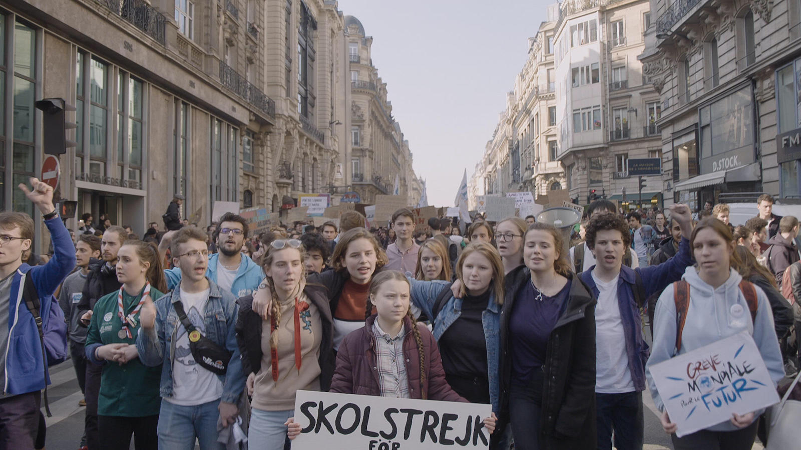 Greta Thunberg marches with fellow youth activists.
