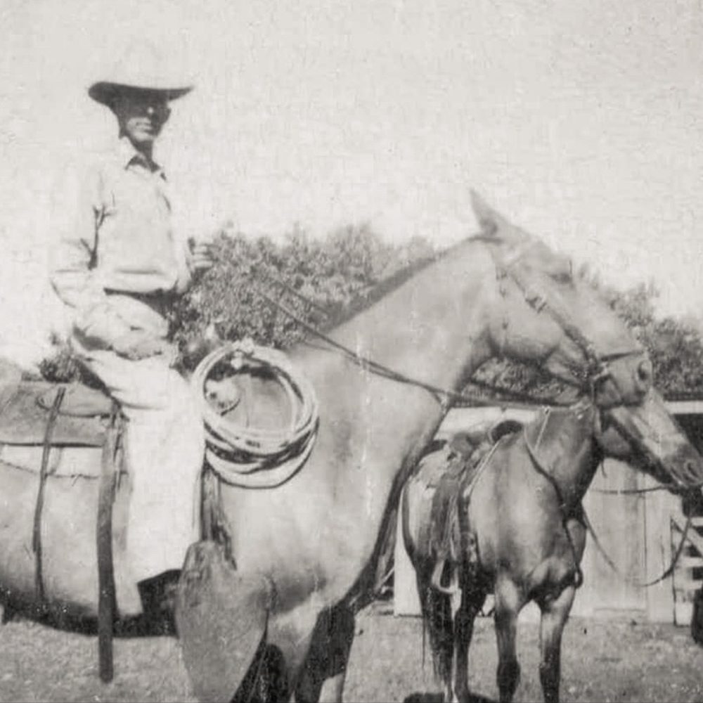 Black and white photo of Brack Goolsby on a horse