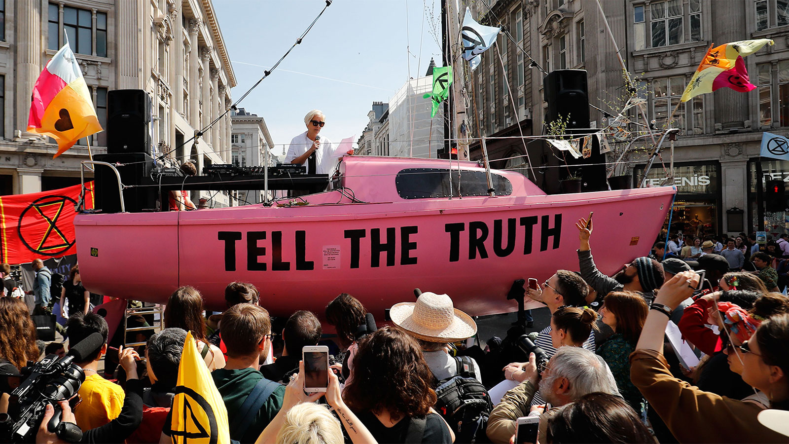 British actress Emma Thompson gives an address from the stage atop a pink boat during an Extinction Rebellion protest