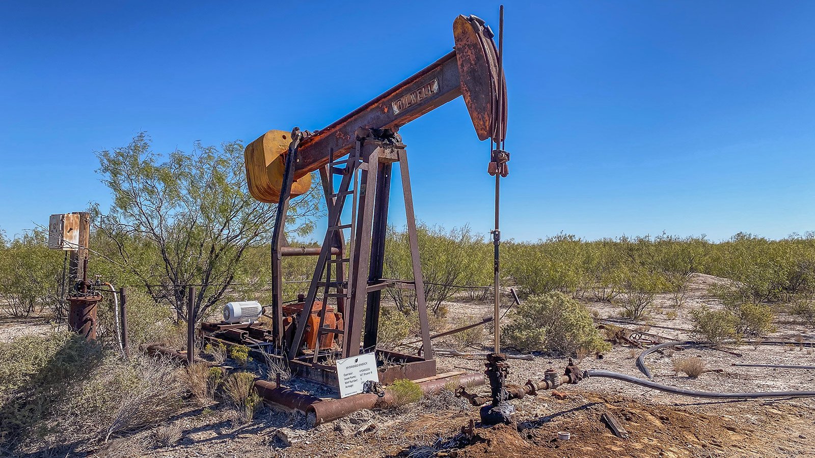 rusted pumpjack abandoned oil well