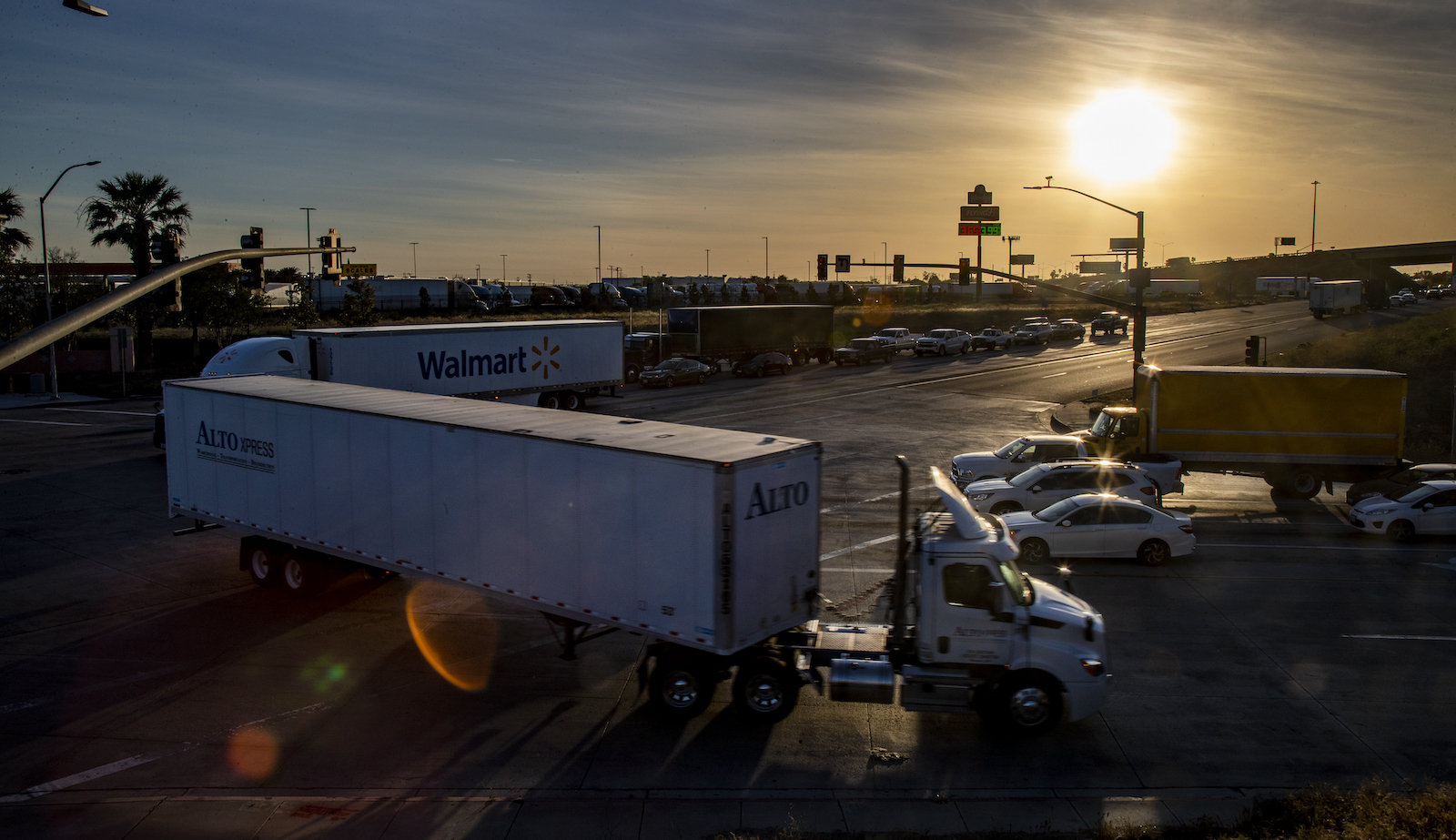 Diesel trucks increase traffic at an intersection in San Bernardino, California.