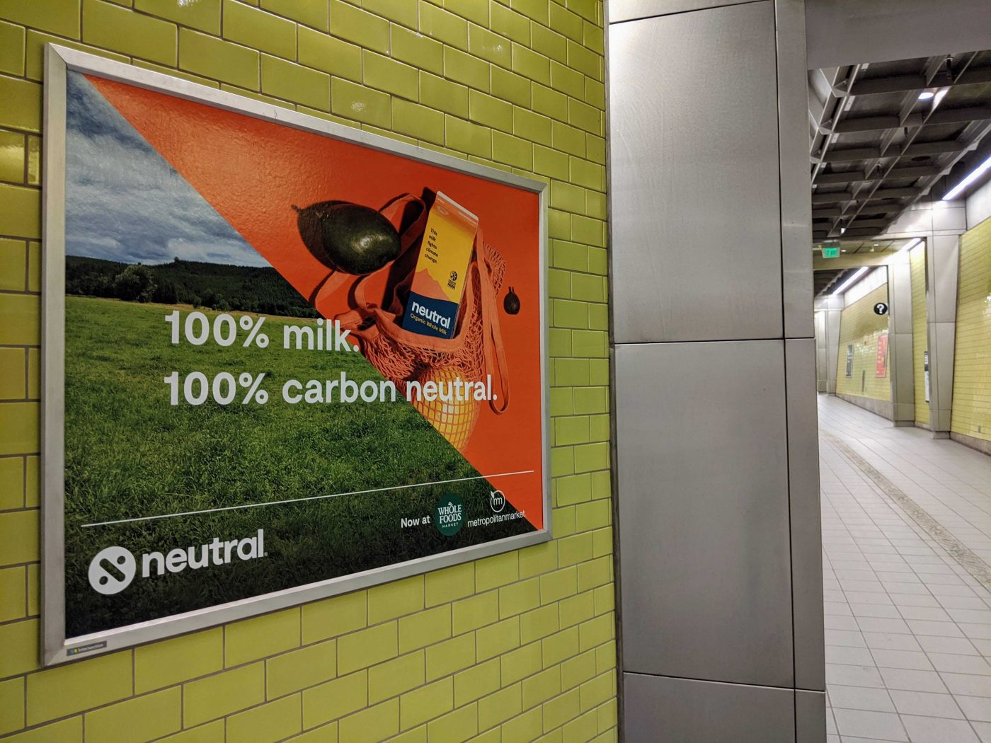 An advertisement says "100% milk. 100% carbon-neutral."