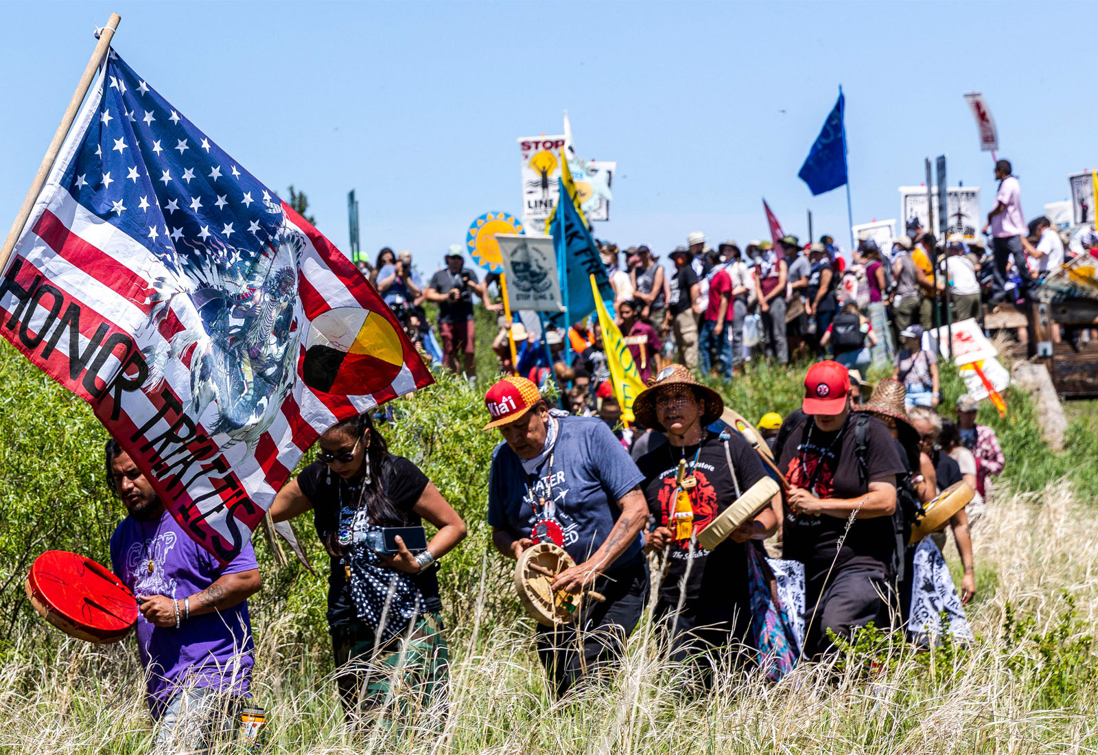 Large group of Indigenous people protesting a pipeline