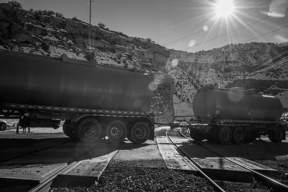 A tanker truck crosses the Union Pacific rail line in Price Canyon, in central Utah, as it heads up Indian Canyon. This area in Price Canyon is where the proposed Uintah Basin Railway will connect with the national railway network. The Uintah Basin Railway is proposed to move crude oil, agriculture, and minerals mined in Utah’s Uintah Basin, an area with long standing freight transportation challenges. Construction of the rail line is slated for 2023-2024.