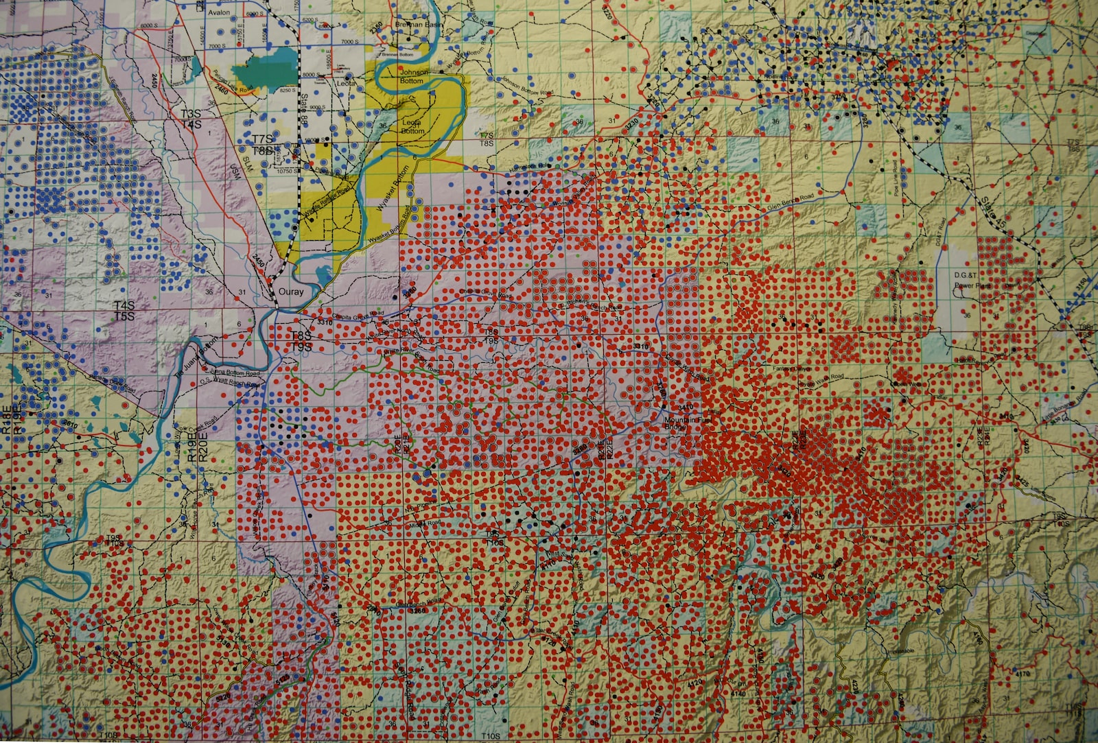 a map covered with red dots for oil and gas wells